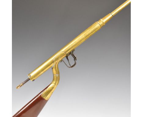 A vintage brass .177 air rifle of unusual construction with externally sprung trigger, straight pull bolt and graduated barre