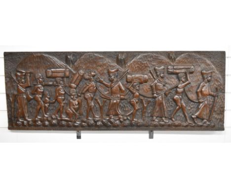 African tribal carved wooden panel decorated with slaves in procession, carved from a single hardwood plank, 44 x 122cm