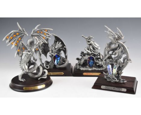 Four Tudor Mint Myth and Magic figures comprising Triumphant Wizard, Dragon Storm, The Eunectus and Celtic Crystal, in boxes