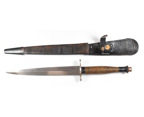 Fairbairn Sykes style fighting knife stamped 2 over 45 and broad arrow, with 18cm blade and sheath. PLEASE NOTE ALL BLADED IT
