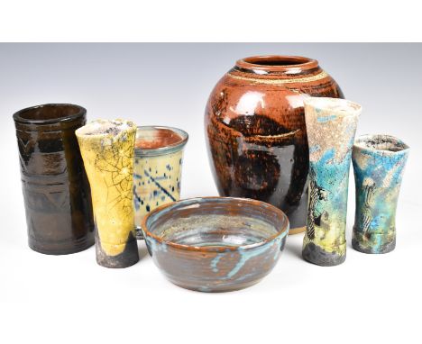 A collection of studio pottery including large vase with indistinct signature, bowl with MB monogram, three vases with impres