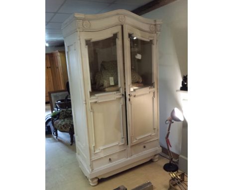 French armoire, glazed doors, interior shelf, 2 drawers under. On off white with pale blue to mouldings. 212 cm high, 112 cm 