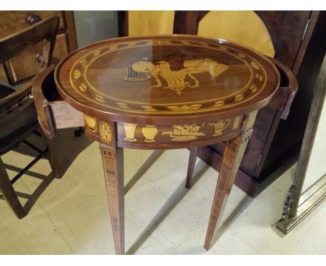 20thC fine quality marquetry inlaid table, oval in shape, drawer at each end. Olivewood veneered panels. Marquetry inlay of h
