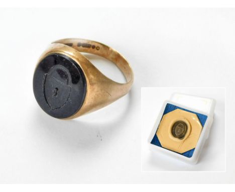 SIGNET RING. A 9ct. gold signet ring, the onyx face intaglio-carved with a padlock for the owner, named 'Silverlock'. Also, a