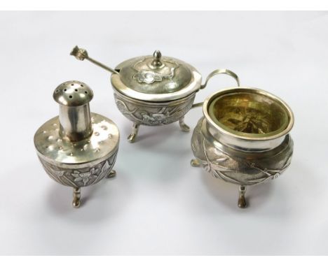 CHINESE CRUET SET. A Chinese silver, three-piece cruet set, decorated with a dragon, flowers & foliage on a stipple ground. W