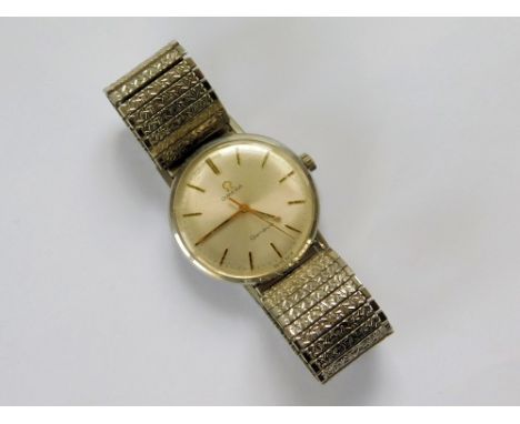 OMEGA. A gentleman's Omega Geneve, 1960's steel wristwatch with black/gold baton markers, gold hands & a sweep seconds hand. 