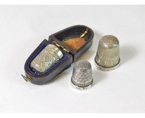 THIMBLES. An Edwardian silver thimble with case, one other silver thimble advertising 'Bruford's Exeter' & a silver plated th