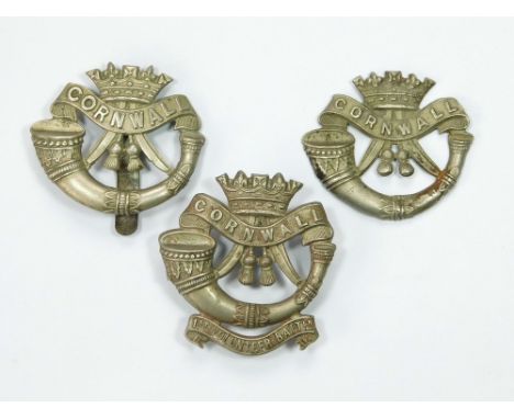 WWI CORNWALL INFANTRY BADGES. Three WWI Duke of Cornwall's Light Infantry badges, each with variations of design. 1st Volunte