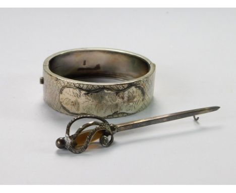 SILVER BANGLE ETC. A Victorian hinged silver bangle, Birmingham 1893. Also, an Edwardian silver & grey agate long-sword brooc