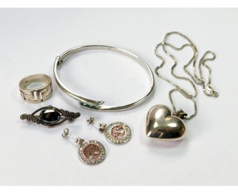 SILVER BANGLE ETC. A silver bangle, set with three turquoise paste stones & a silver 'heart' pendant on silver box link chain