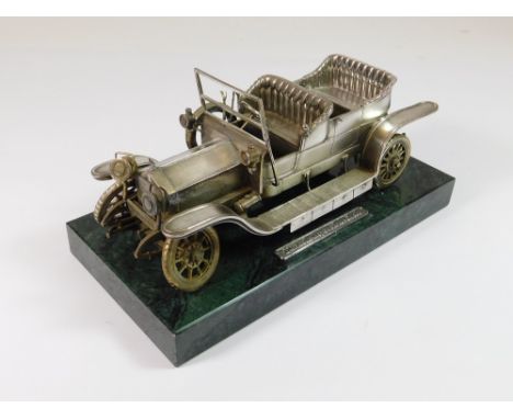 ROLLS ROYCE SILVER MODEL. A solid silver model of a 1907 Rolls-Royce Silver Ghost, designed by Cyril J Lewis Fine Jewels, of 