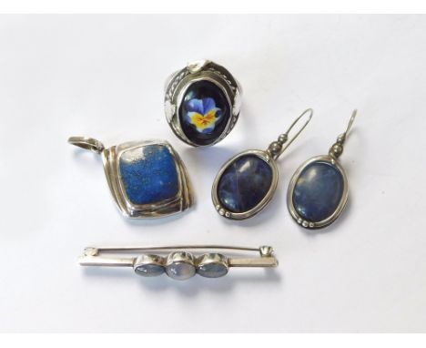 LAPIS LAZULI, ETC. A pendant of 'lapis lazuli', set in silver-coloured metal & a pair of similar earrings. Also, a silver-col