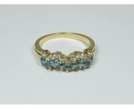 DRESS RING. An 18ct. gold dress ring set with synthetic stones. Approx. 3.72g. Size L/M.  Please note that all items in this 