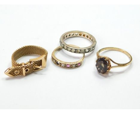 DRESS RINGS. A 9ct. gold smoky quartz dress ring, a 9ct. gold ruby & diamond half-hoop ring (lacking one diamond) & two other