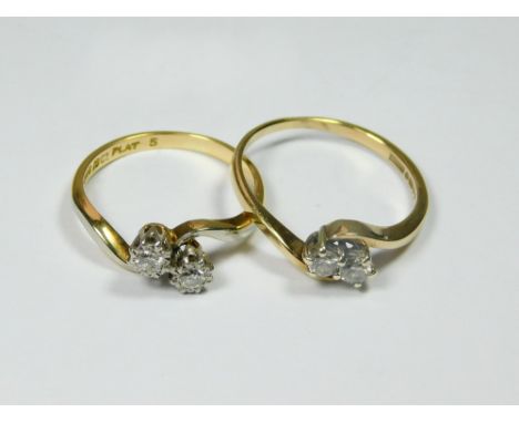 DIAMOND RINGS. An 18ct. gold & platinum, illusion set cross-over diamond ring & a 9ct. gold cross-over diamond ring.  Please 