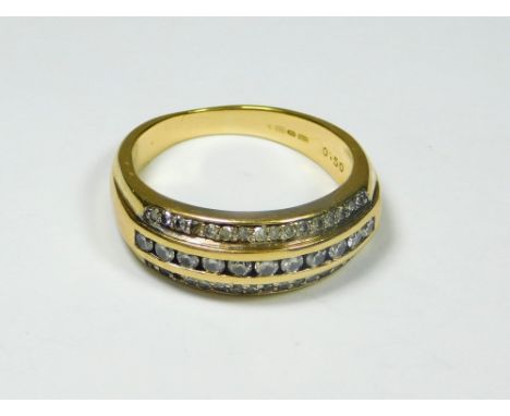 DIAMOND RING. An 18ct. gold, channel-set diamond ring. Total diamond weight approx. 0.50ct. Size N. Approx. 7g.  Please note 