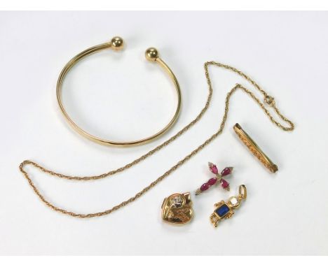 GOLD PENDANTS ETC. Three 9ct. gold pendants, an unstamped chain necklace, an unstamped bangle & a gold plated small brooch.  