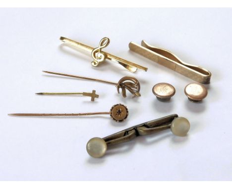 STICK PINS. Two Victorian stick pins, one in 9ct. gold. Also, three various tie clips, two studs & a gilt metal 'cross' lapel