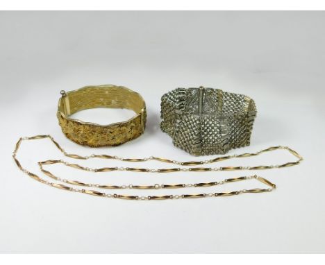 BRACELETS ETC. A silver-gilt filigree bangle, a white metal part-filigree bracelet & a gilt metal long chain necklace.  Pleas