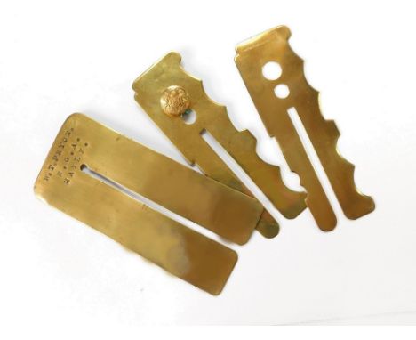 ARMY BUTTON POLISHING STICKS ETC. Three brass army button polishing sticks, one stamped 'W. T. Pryor Hayle R.G.A.' (Royal Gar