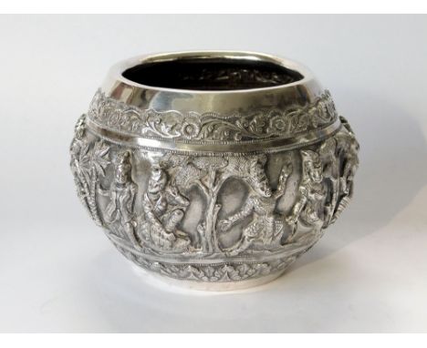 BURMESE SILVER. A late 19th century Burmese silver 'offering' bowl, with rolled rim, & a central band of embossed & chased de