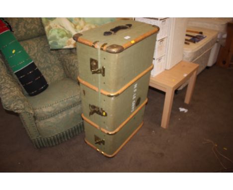A wooden bound canvas travelling trunk 