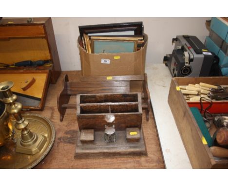 a box of various picture frames; an oak sliding book trough and an oak desk stand