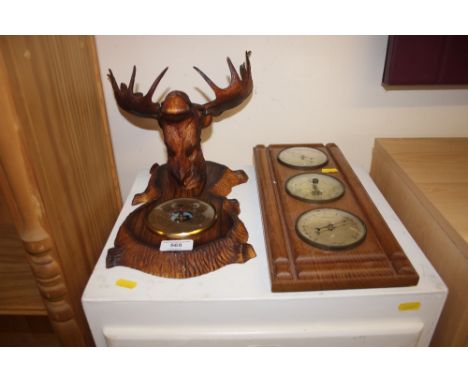 A barometer mounted with a mouses head and a clock barometer and thermometer set