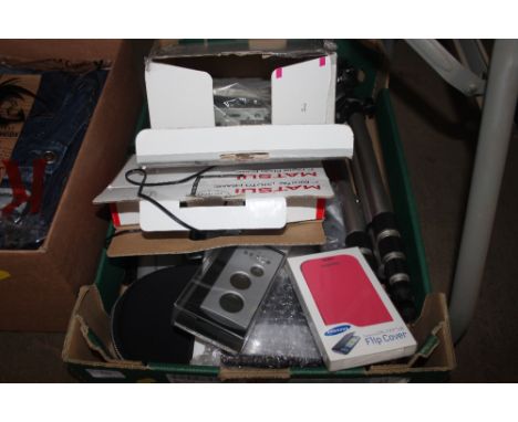 A box containing a car stereo; a camera tripod etc.  