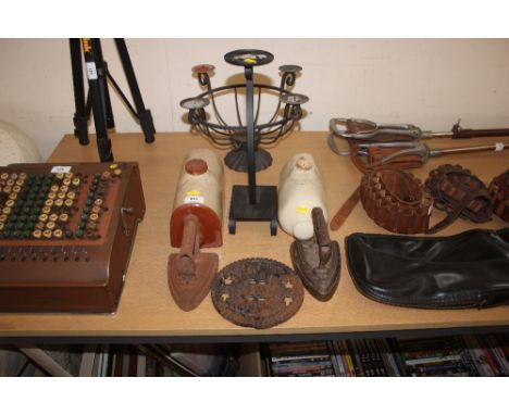 Two flat irons; two stoneware hot water bottles; candelabra etc