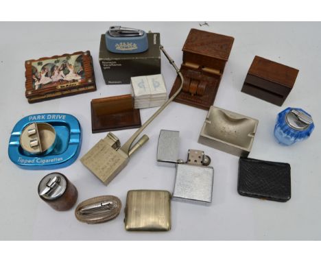 A collection of of smoking related collectables to include a boxed Ronson Jasperware varaflame table lighter, a novelty 'Pick