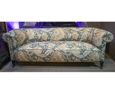 CHESTERFIELD SOFA, 68cm H x 201cm x 87cm, late Victorian mahogany, circa 1890, in new foliate patterned upholstery on ceramic