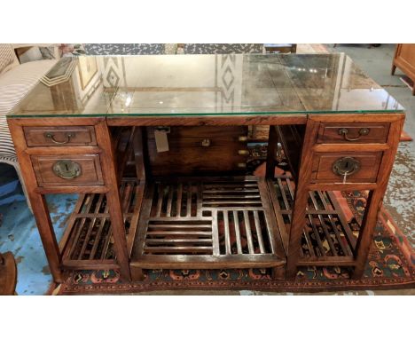 CHINESE PEDESTAL DESK, probably 19th century elm, each side fitted with two drawers, raised footrest to centre, slatted under