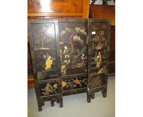 Japanese black lacquered chinoiserie and hardstone inlaid three panel folding screen (a/f)