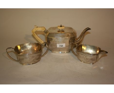 Sheffield silver three piece tea service having floral engraved decoration, makers mark S & W
