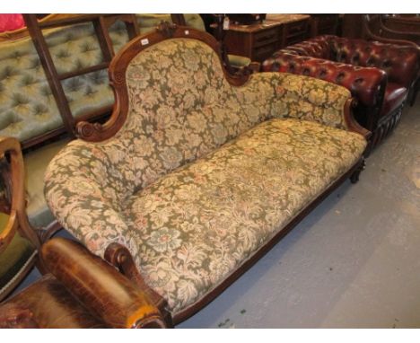 Victorian carved walnut and upholstered sofa on turned tapering fluted supports