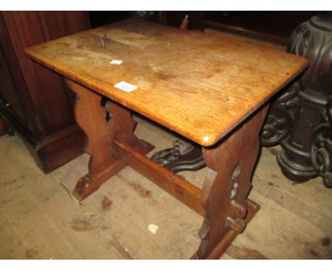 Rectangular low oak trestle ended coffee table, nest of three coffee tables and an oak three shelf wall bracket