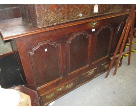 18th Century oak mule chest with hinged plank lid above a four panel front and three drawers