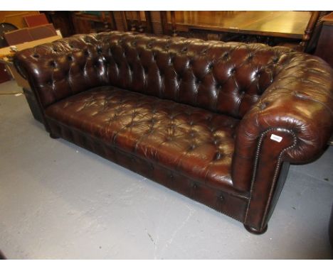 20th Century brown leather button upholstered two seat sofa having loose cushions