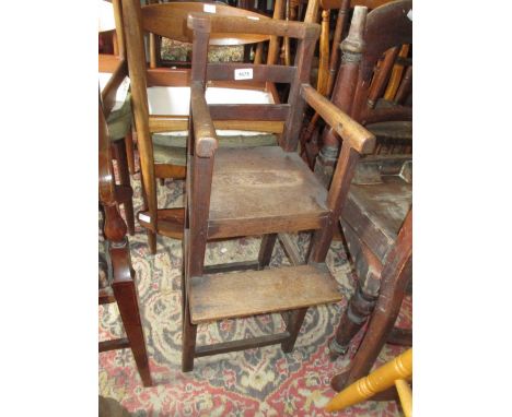 George III oak child's highchair with a ladder back above panel seat, raised on square supports