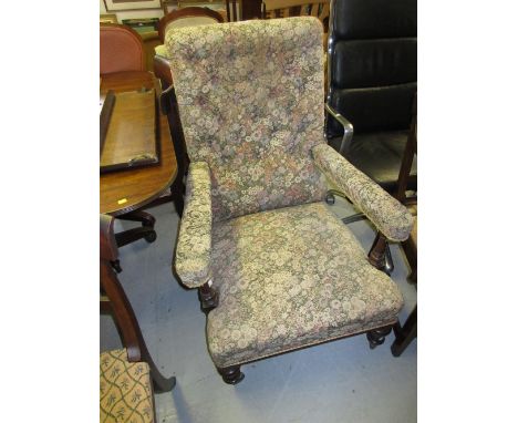 19th Century mahogany open arm library chair having button upholstered back, raised on turned tapering front supports with br