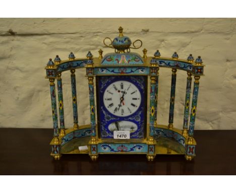 20th Century gilt brass and cloisonne mounted mantel clock with porcelain panels, the circular dial with Roman numerals havin
