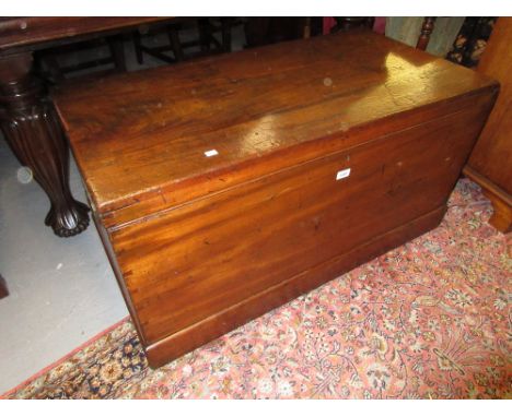 Large 19th Century mahogany trunk having hinged cover with brass flush handles and plinth base