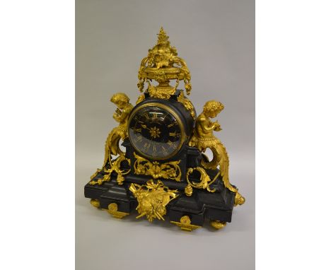 Fine quality 19th Century French black slate and ormolu mounted mantel clock, the drum form case surmounted by flower filled 