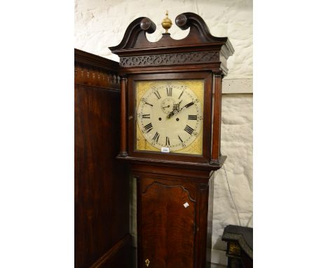 Early 19th Century mahogany longcase clock, the square hood with swan neck pediment and blind fretwork decoration above a sha