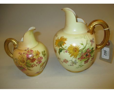 Royal Worcester blush ivory flat back jug vase painted with flowers together with another similar smaller jug