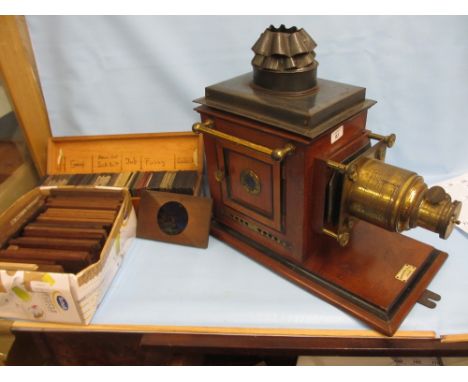 Perken and Son, London, 19th Century mahogany gilt brass and tin plate magic lantern together with various slides and a relat