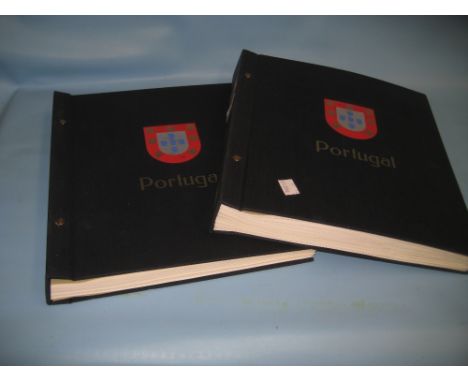 Comprehensive stamp collection contained in two blue Davo albums including many stamps of Portugal