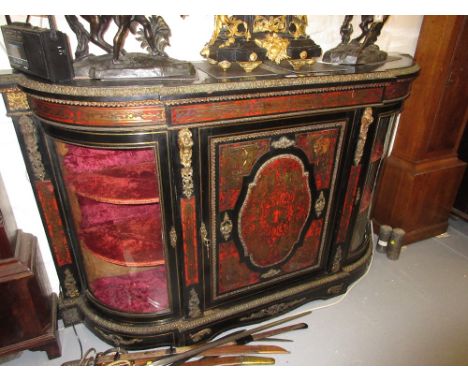 19th Century red tortoiseshell buhl and ormolu mounted credenza with a centre panel door flanked by glazed bow doors raised o