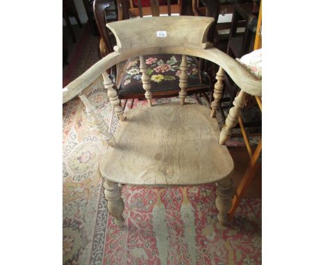 Elm and beech bow back chair with panel seat raised on turned supports